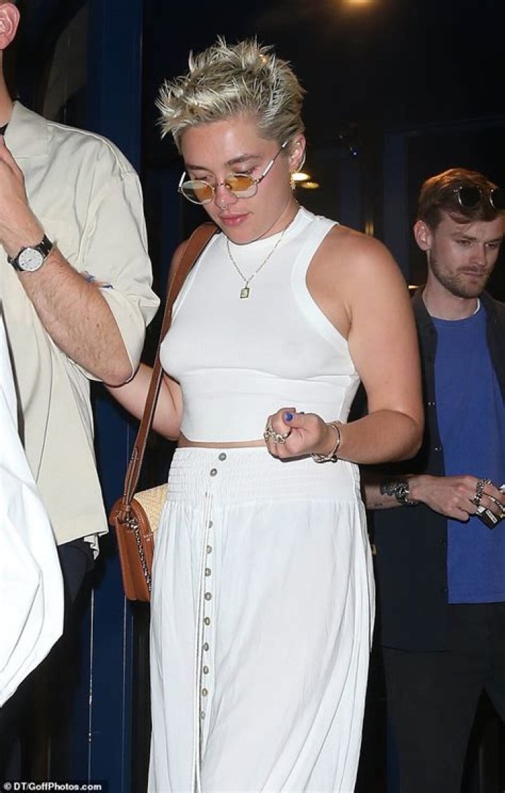 Megan Fox goes braless in see-through white crop top as she parties in London with fiance Machine Gu |